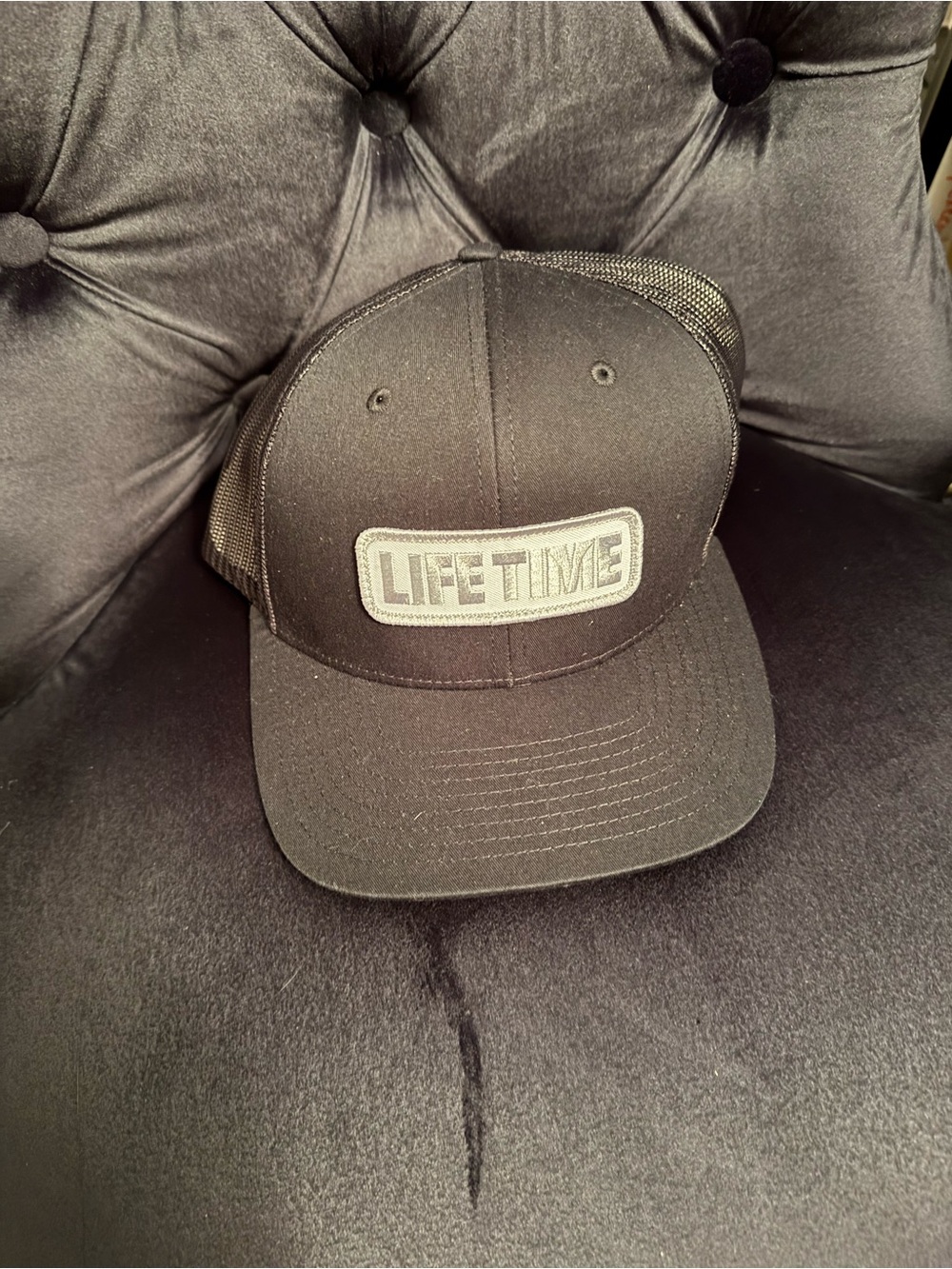 Lifetime Fitness Black Trucker Hat with Logo Patch
